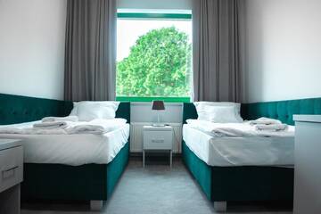 Фото номера Улучшенный двухместный номер с 2 отдельными кроватями Отель Hotel Promenada Biznes &amp; Wypoczynek г. Радом 2